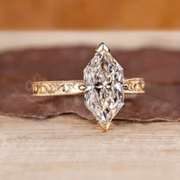 Custom diamond engagement ring with unique Dutch marquise design.