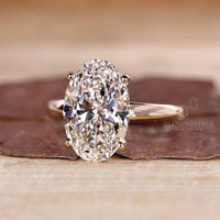 Four prong setting oval diamond ring.
