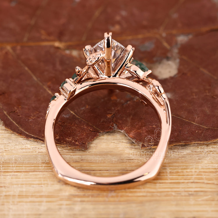 Buy engagement ring crafted with Dutch marquise and round side stones.