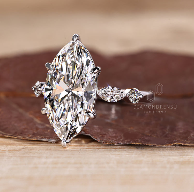 Shared prong pave marquise diamond ring.
