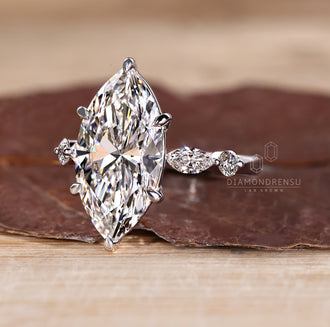 Shared prong pave marquise diamond ring.