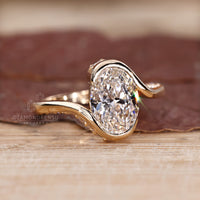 Handmade oval cut diamond ring with hidden pavé details.
