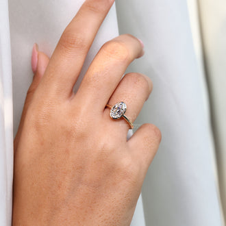 Custom oval old European cut diamond engagement ring in yellow gold.