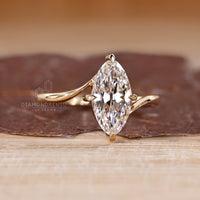 Elegant bypass ring with marquise lab grown diamond.