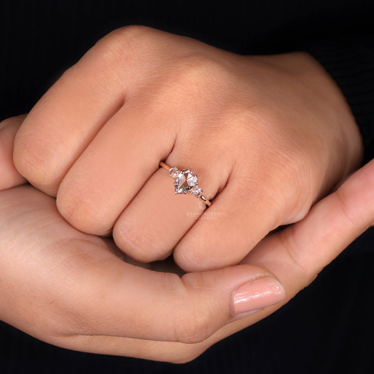 Three Stone Engagement Ring with IGI certified pear diamond.