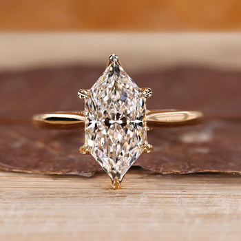 Hidden halo ring with Dutch marquise diamond in yellow gold setting.
