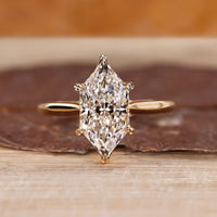 Hidden halo ring with Dutch marquise diamond in yellow gold setting.