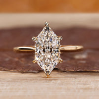 Hidden halo ring with Dutch marquise diamond in yellow gold setting.