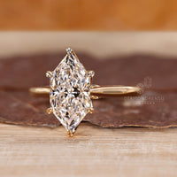 Tapered shank ring in yellow gold with a tulip-inspired setting.