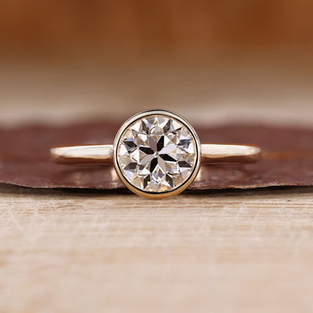 Old European Cut Engagement Ring With Round OEC Diamond In Bezel Setting.