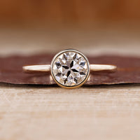 Old European Cut Engagement Ring With Round OEC Diamond In Bezel Setting.