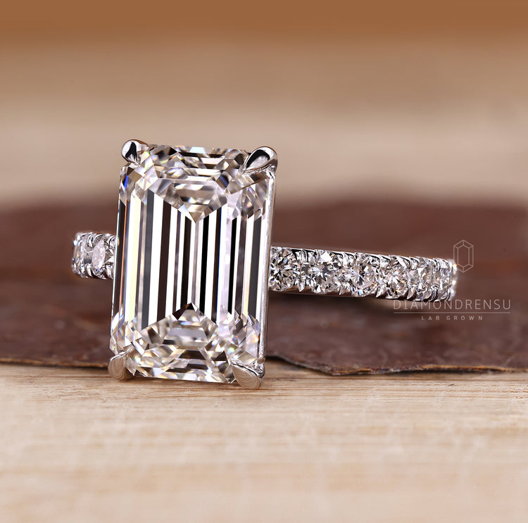 Four claw prong emerald cut diamond ring.