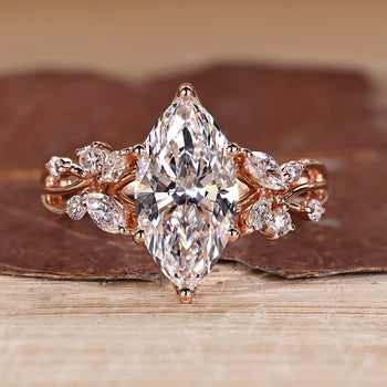 Marquise cut diamond ring with marquise and round side stones.