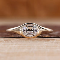 Old mine cushion cut diamond ring in east to west solitaire setting.