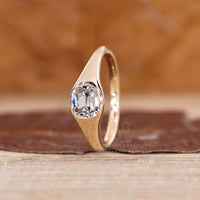 Lab grown cushion cut diamond ring with elegant tapered shank.