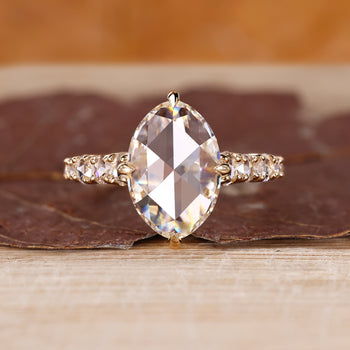 Open gallery ring with oval rose cut engagement ring.