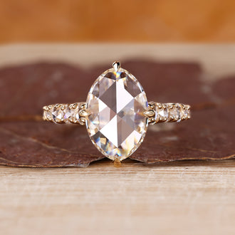 Open gallery ring with oval rose cut engagement ring.