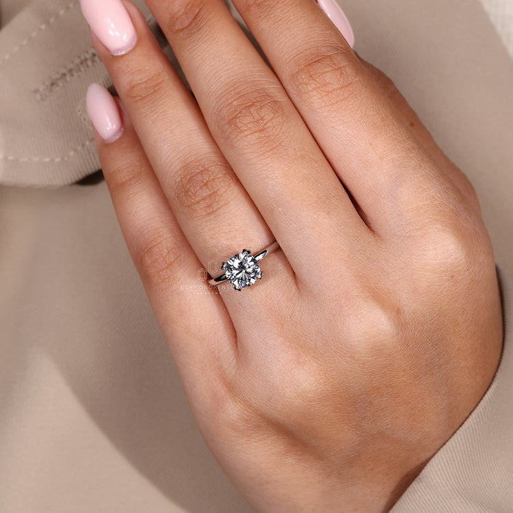 Lab grown diamond solitaire ring with a polished white gold band.