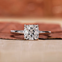 A cushion cut engagement ring with a classic and elegant design in a soft velvet box.