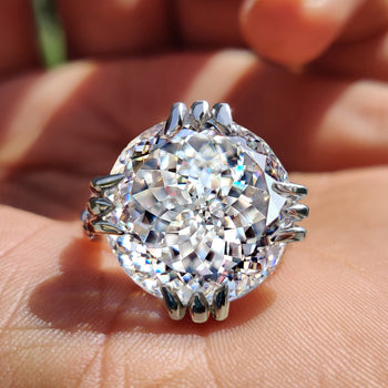Round moissanite ring with brilliant sparkle.