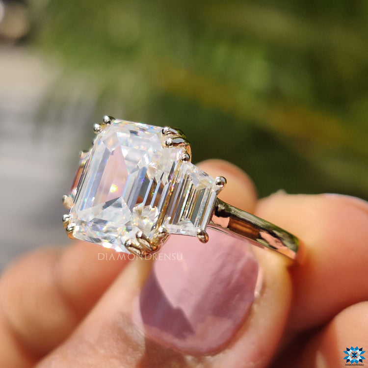 Prong setting for an elegant three stone moissanite engagement ring.