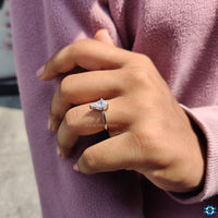 Buy moissanite ring with a striking spear cut set in a delicate prong setting.