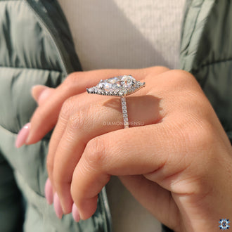 Round moissanite in halo setting, offering a brilliant and radiant look.