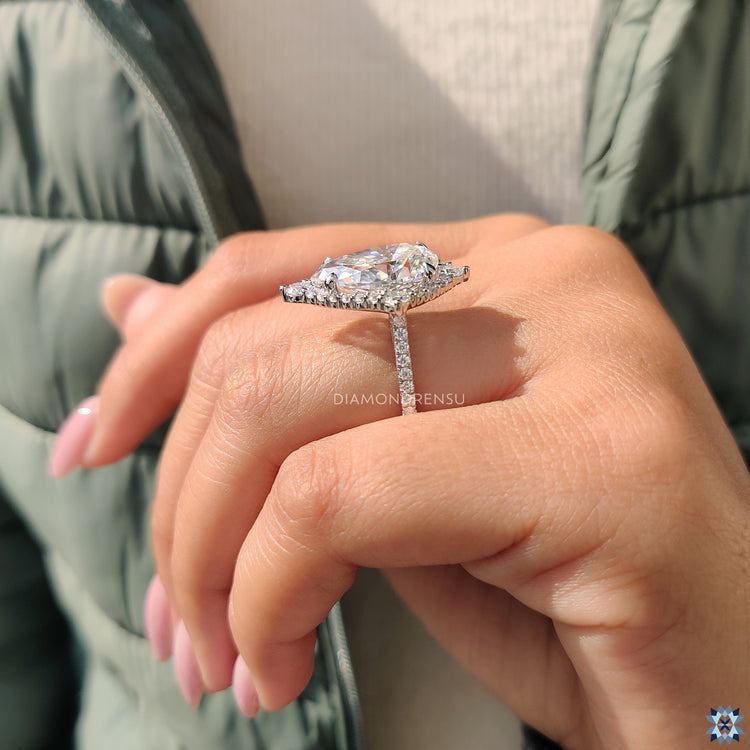 Round moissanite in halo setting, offering a brilliant and radiant look.