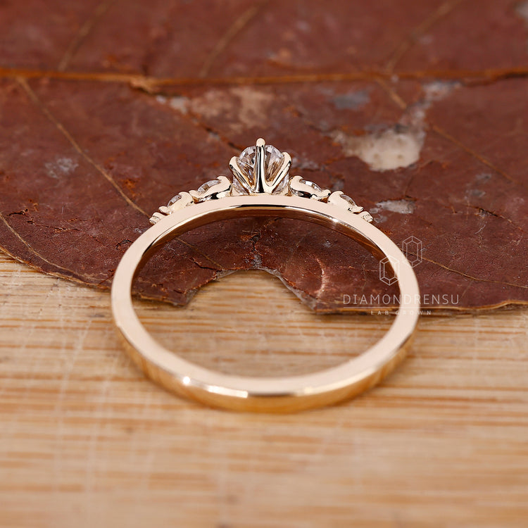 Lab Grown Diamond ring with 6 prong setting and round side stones.