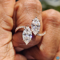 Pave wave ring with a graceful flowing band.