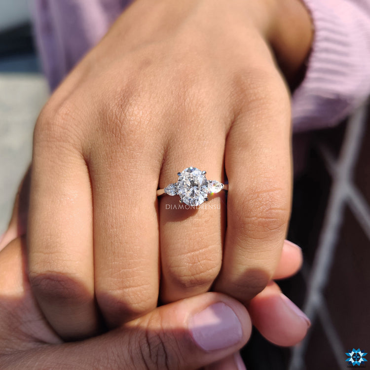 Oval and pear engagement ring in elegant design.