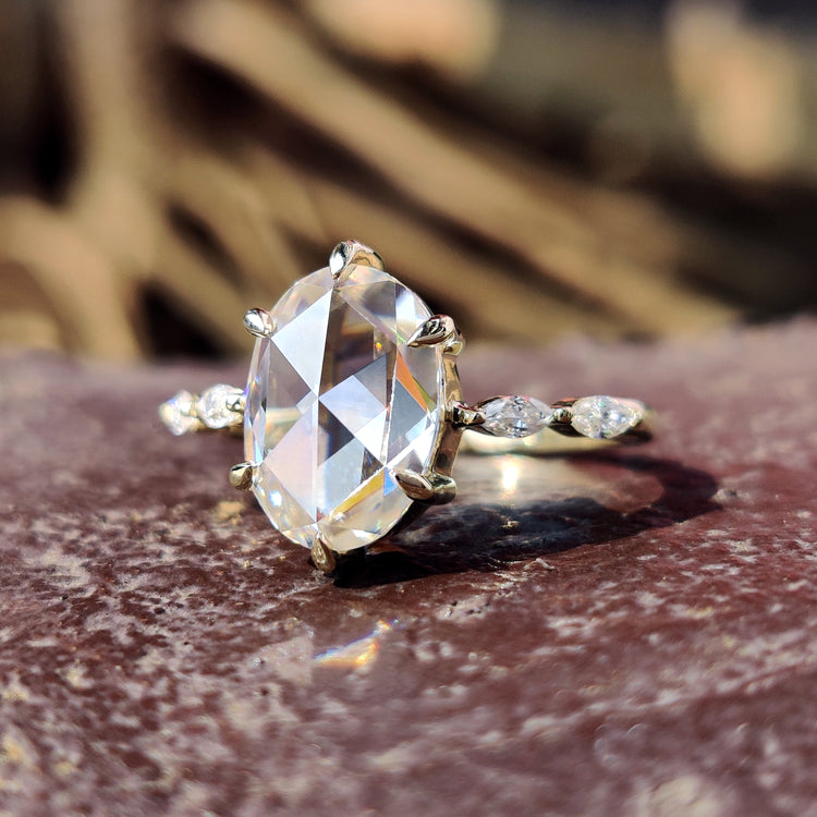 Oval rose cut engagement ring with a unique design.