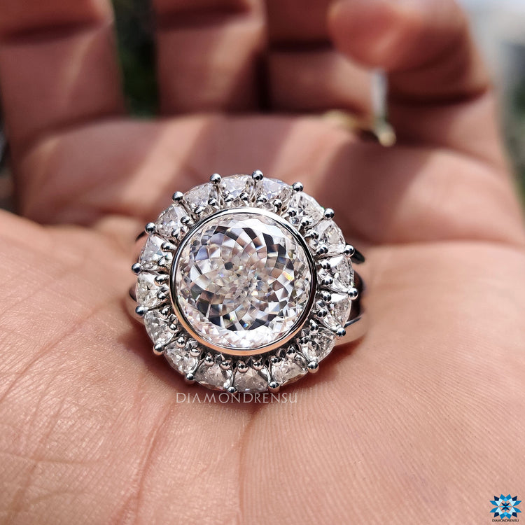 Handmade diamondrensu engagement ring with a unique Portuguese cut moissanite setting.