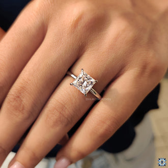 Diamondrensu engagement ring featuring a princess cut diamond.