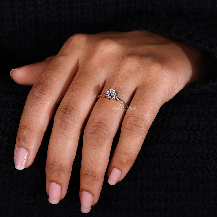 Yellow Gold Solitaire Ring with a brilliant Portuguese cut diamond.