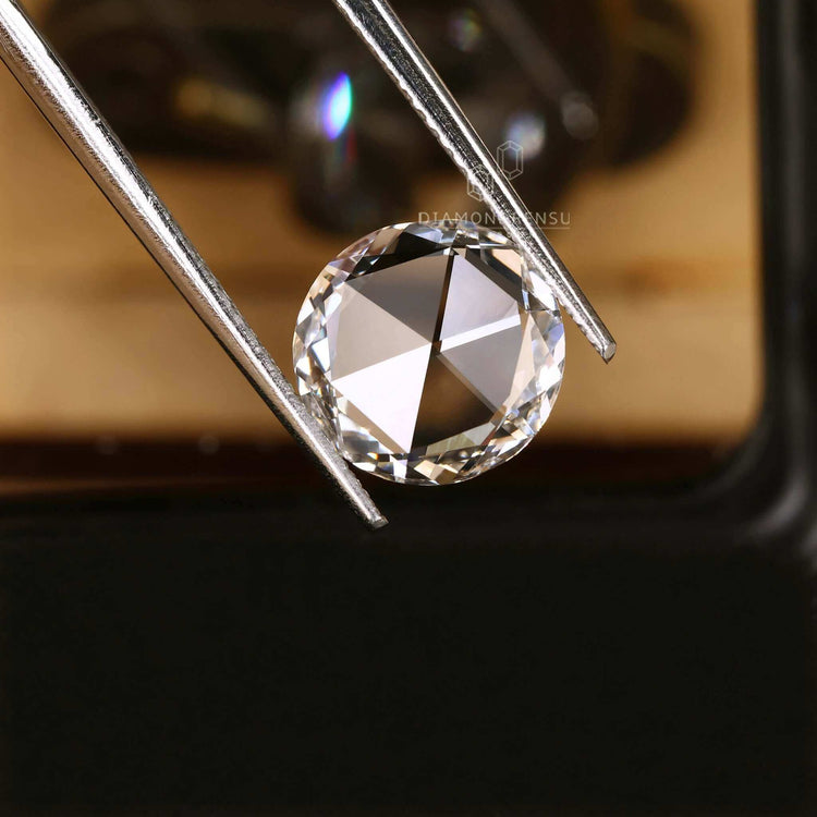 This loose diamond is a lab grown stone with an antique round rose cut.