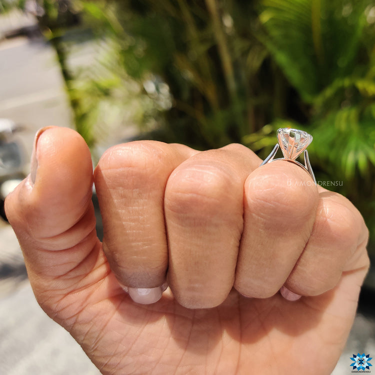 Diamondrensu engagement ring with a white gold solitaire setting.