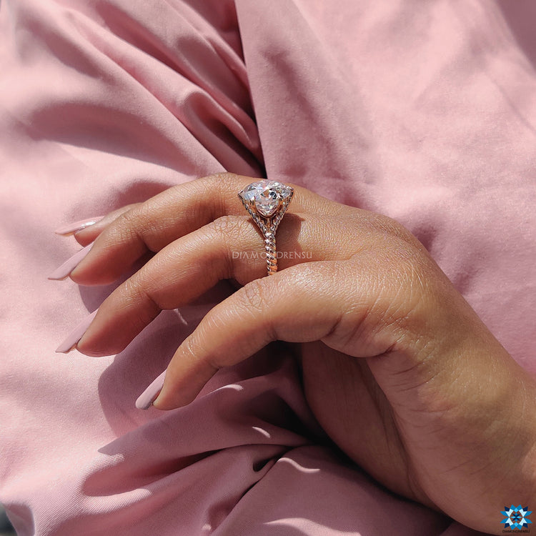 Rose gold moissanite ring with a romantic shine.