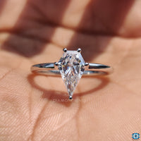 Moissanite ring crafted in white gold with a unique spear cut design.