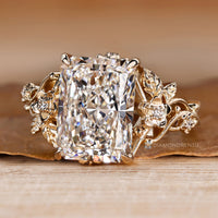 Nature inspired engagement ring with round side stones.