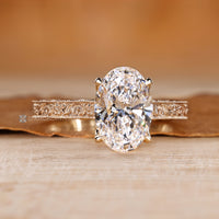 Cathedral setting with four claw prong setting and milgrain details.