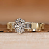 Oval lab grown diamond ring with five stone design.