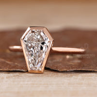 Diamondrensu solitaire ring with lab grown coffin cut diamond.