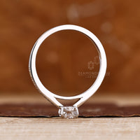 Diamondrensu coffin ring with lab grown diamond center stone.
