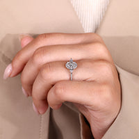 Lab grown oval ring with halo and tapered band.