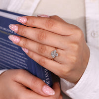 Handmade coffin engagement ring with four prong setting.