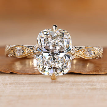 Cushion cut diamond ring with a twisted shank.