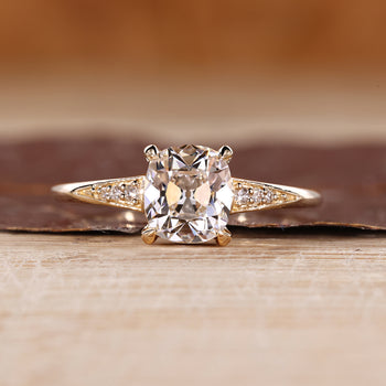 Old Mine Cut Diamond Ring With Round Side Stones.