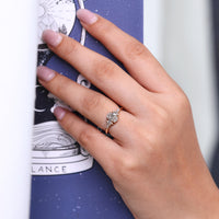 Handmade oval engagement ring with four prong setting.