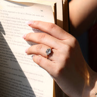 Handmade cushion OMC diamond ring with tapered shank design.